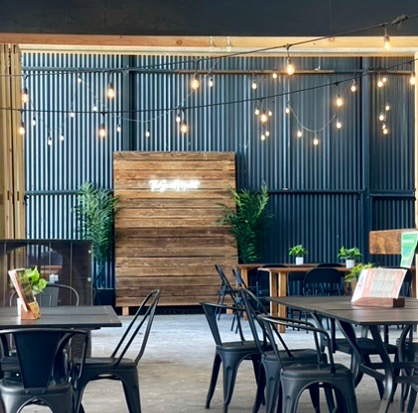 Covered patio with string lights and seating